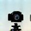 Professional Equipment Icon - a modern DSLR camera silhouette